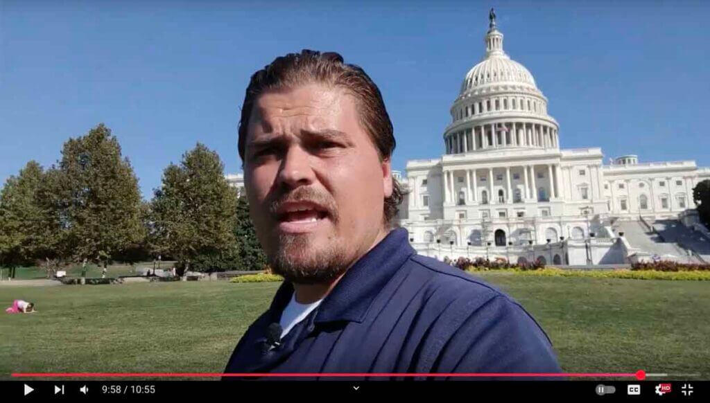 The Nomadic Professor filming a mini-lecture at the Capitol on the Webster-Hayne debate